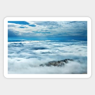 Little island in a sea of clouds Sticker